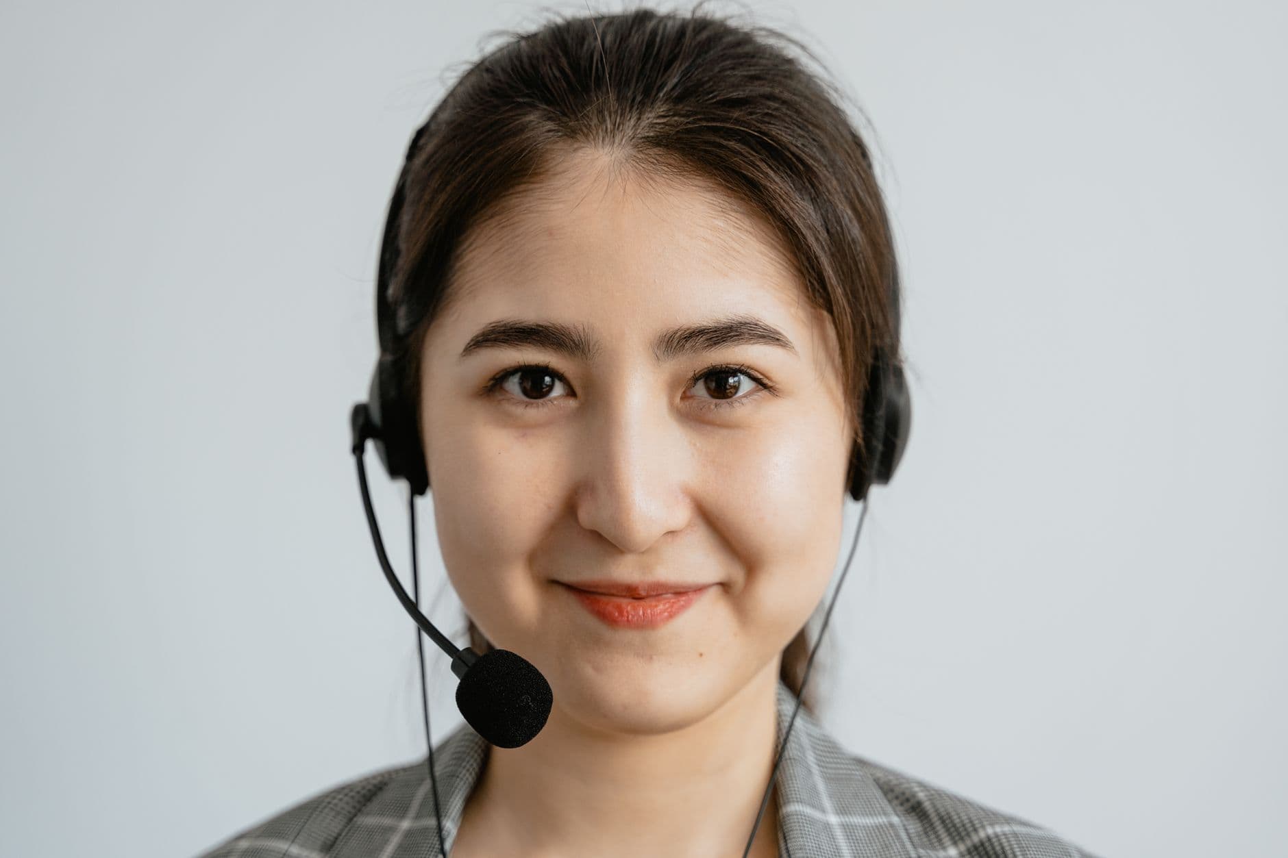 A support agent wearing a telephone headset
